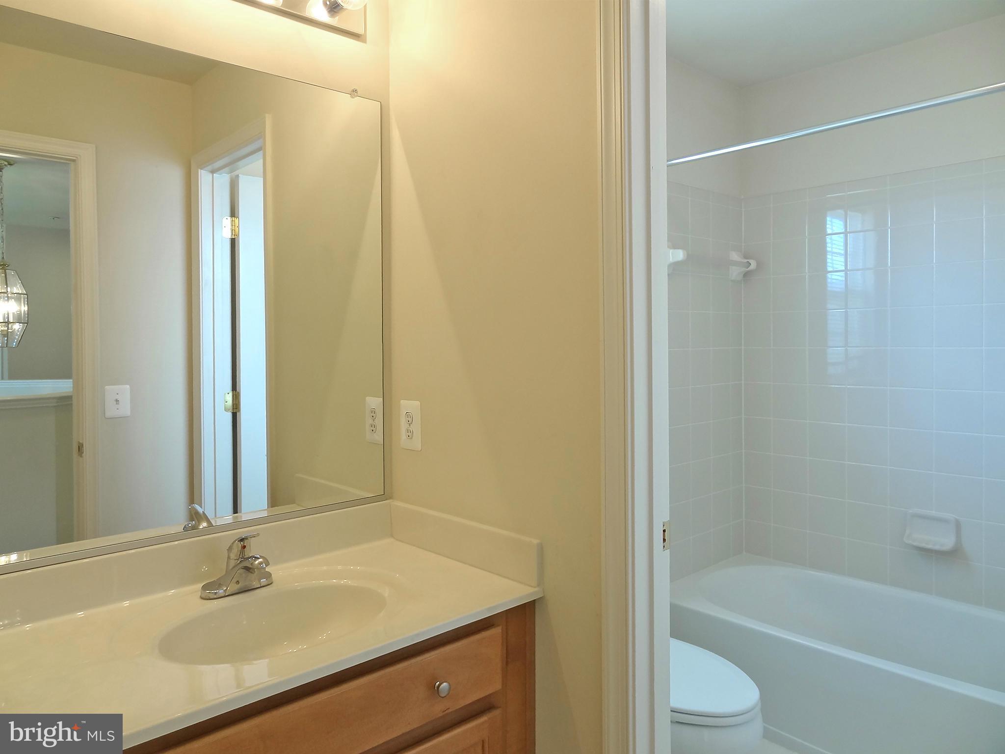 9800 Traver Street Bowie, MD 20721 - Photo 25 of 30 a bathroom with a sink and a mirror