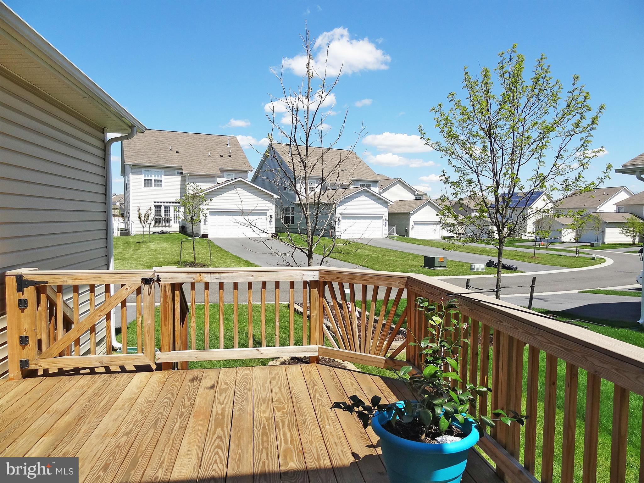 9800 Traver Street Bowie, MD 20721 - Photo 26 of 30 a view of a balcony with wooden floor and potted plants