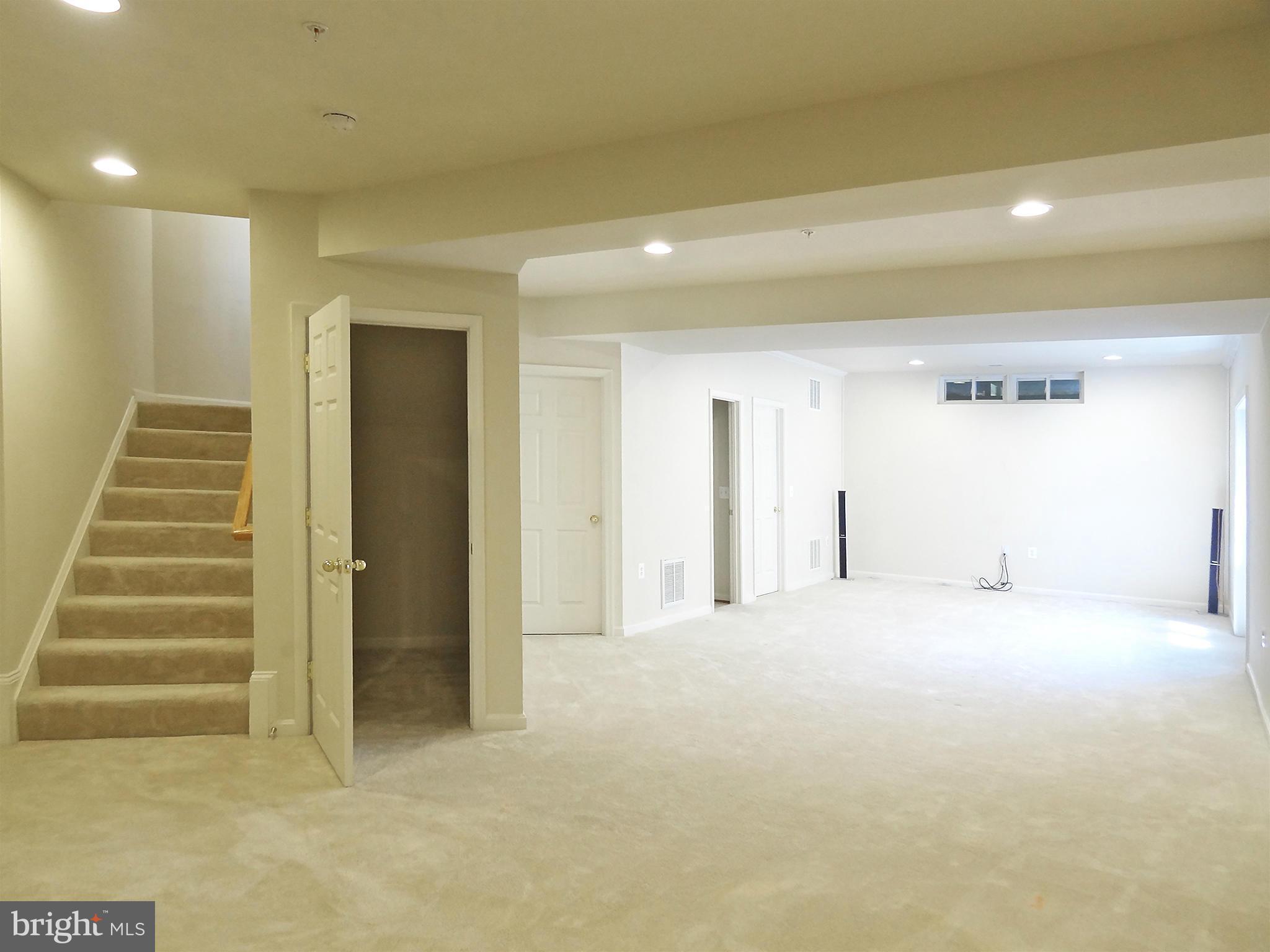 9800 Traver Street Bowie, MD 20721 - Photo 28 of 30 a view of an empty room with stairs