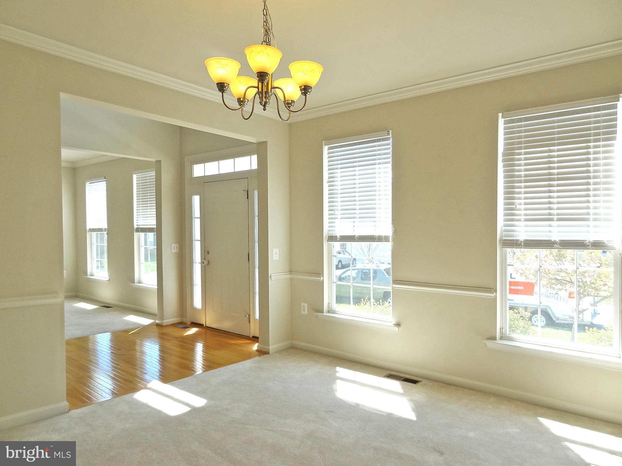 9800 Traver Street Bowie, MD 20721 - Photo 6 of 30 a view of a livingroom with a chandelier