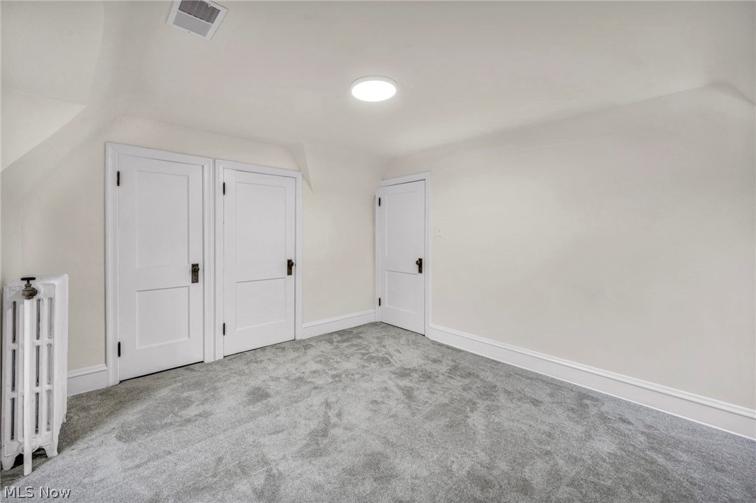 17409 Fernway Road Cleveland, OH 44120 - Photo 34 of 47 Bonus room featuring light colored carpet and lofted ceiling