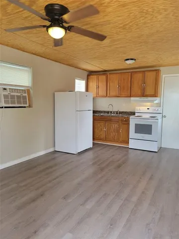 a view of kitchen with wooden floor