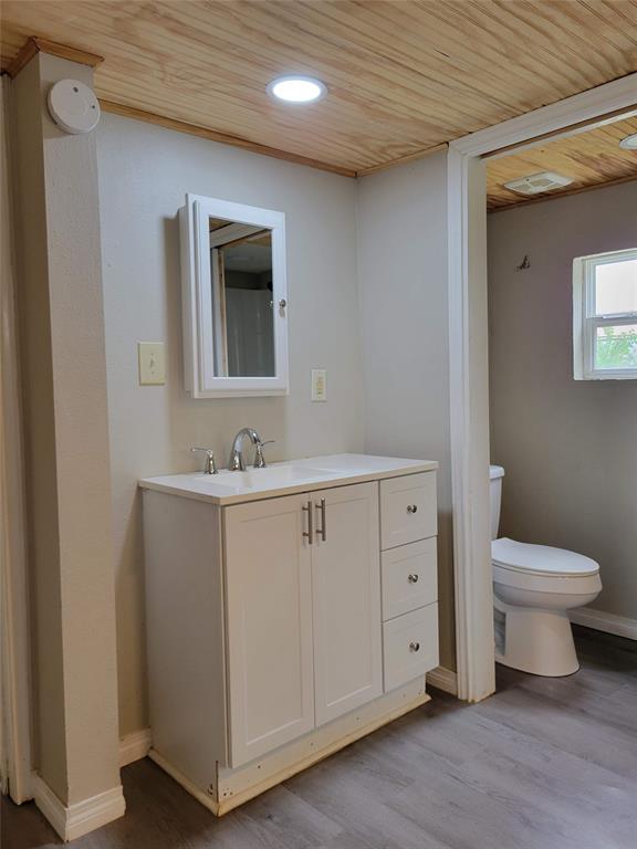 310 Carson Circle Gun Barrel City, TX 75156 - Photo 7 of 14 a spacious bathroom with a toilet sink and mirror