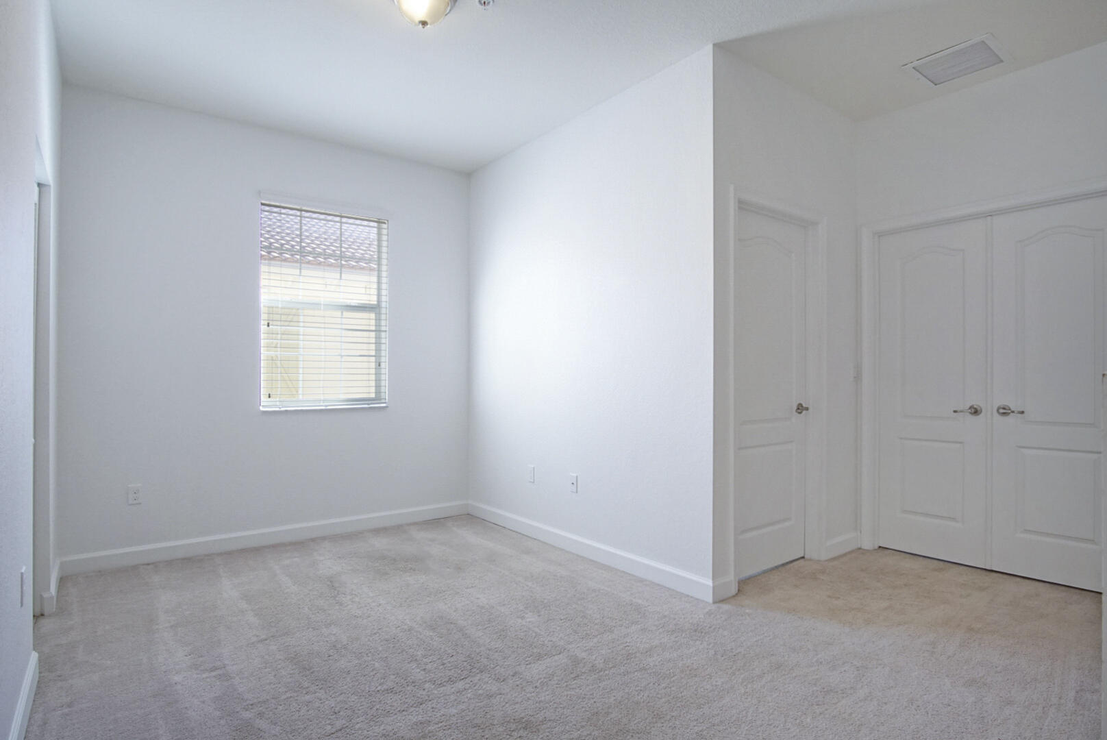 9598 Southwest Purple Martin Way Stuart, FL 34997 - Photo 21 of 23 Master bedroom