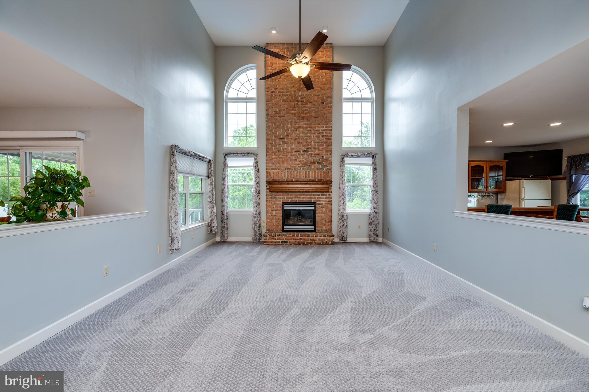 1013 Conifer Road Leesport, PA 19533 - Photo 12 of 102 a view of an empty room with a fireplace and a window