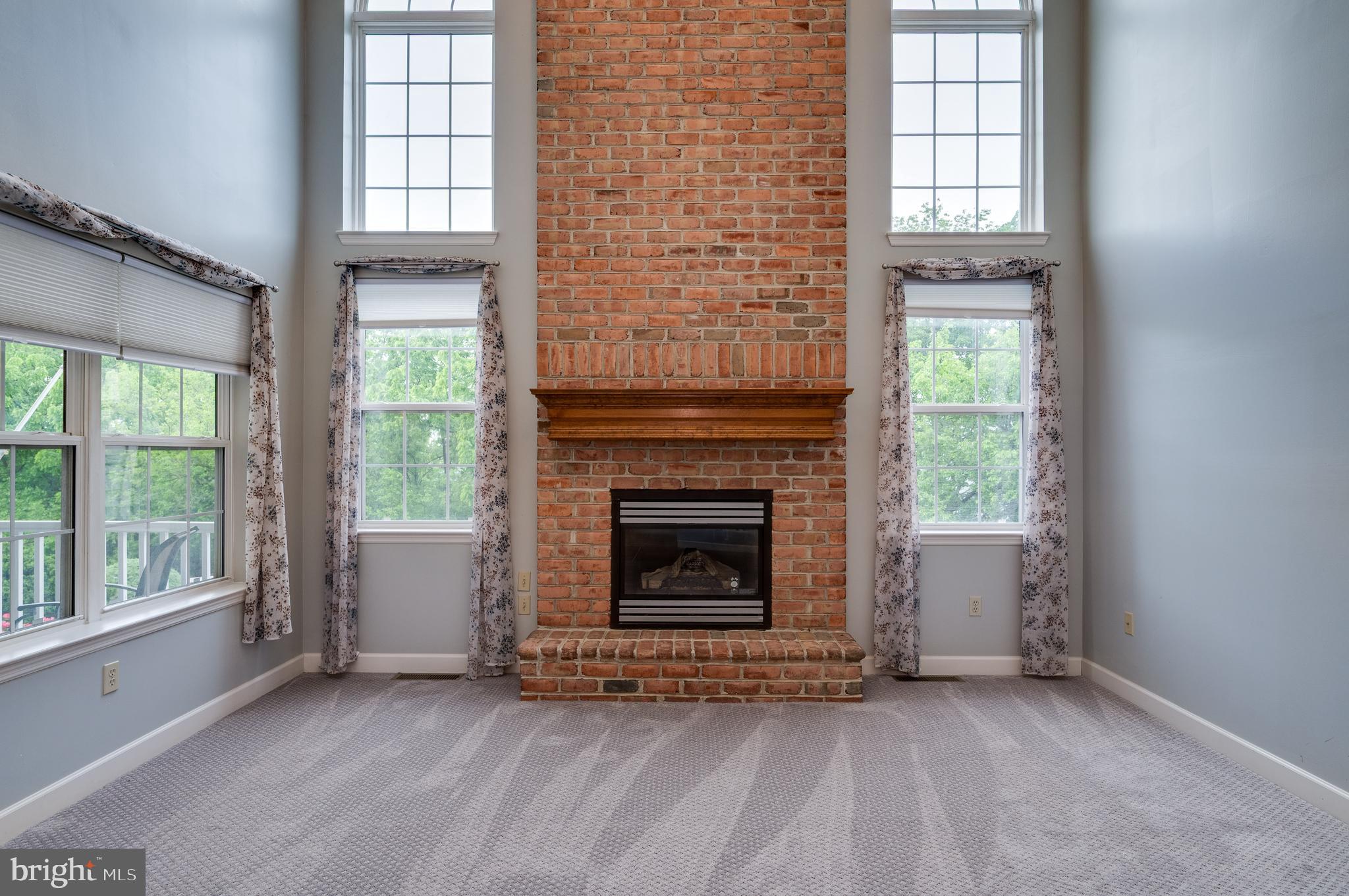 1013 Conifer Road Leesport, PA 19533 - Photo 13 of 102 an empty room with windows and fireplace