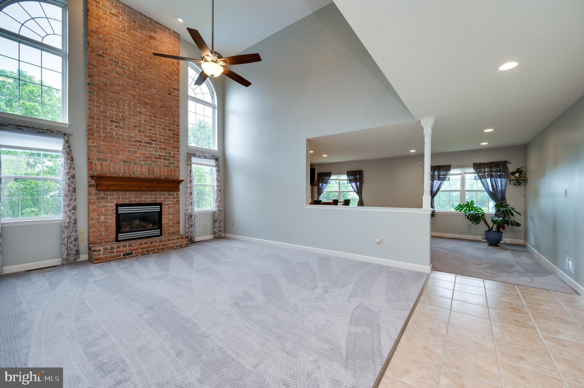 1013 Conifer Road Leesport, PA 19533 - Photo 14 of 102 a view of an empty room with a fireplace and a window