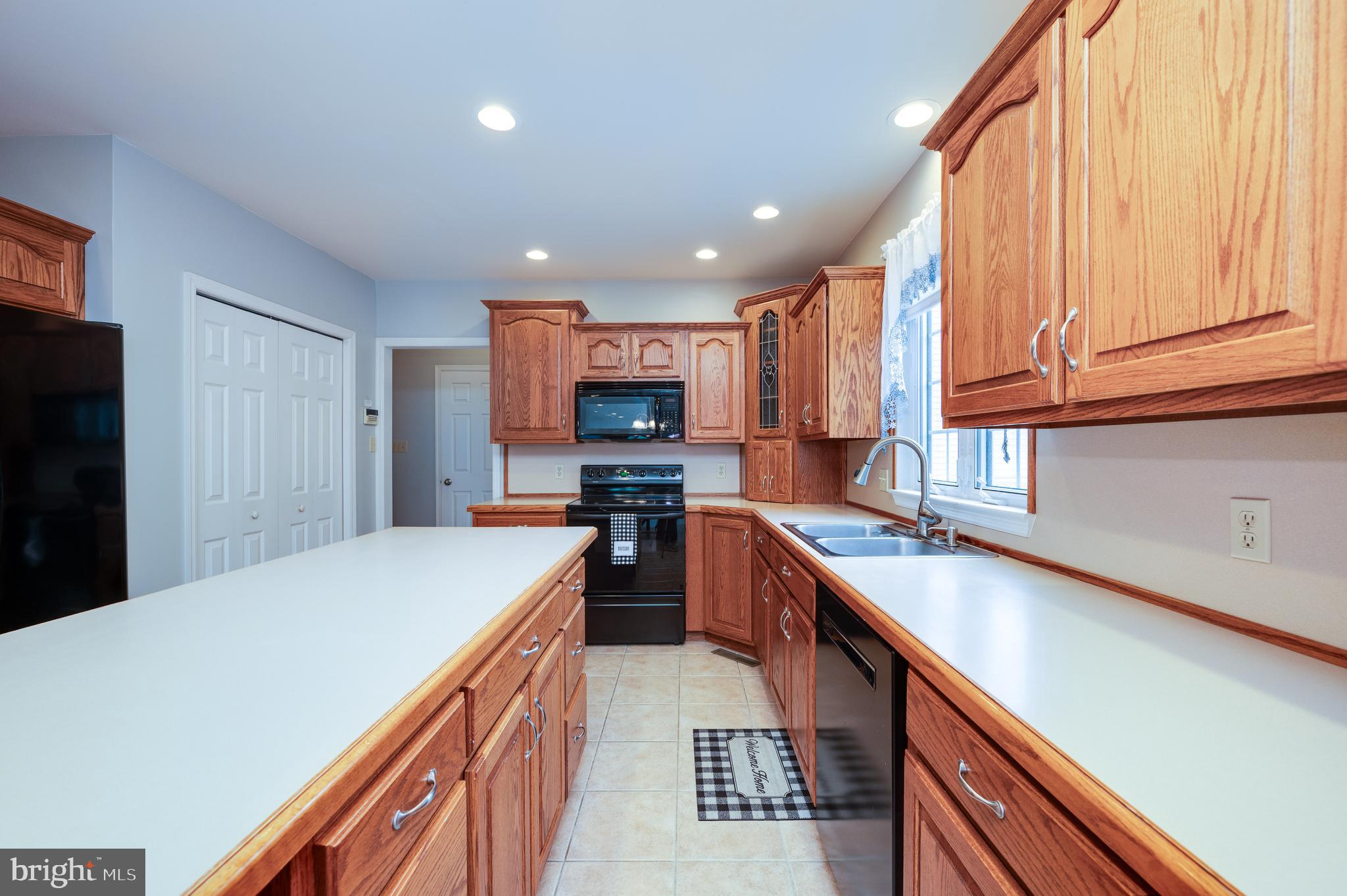 1013 Conifer Road Leesport, PA 19533 - Photo 26 of 102 a kitchen with stainless steel appliances a sink dishwasher stove refrigerator and cabinets
