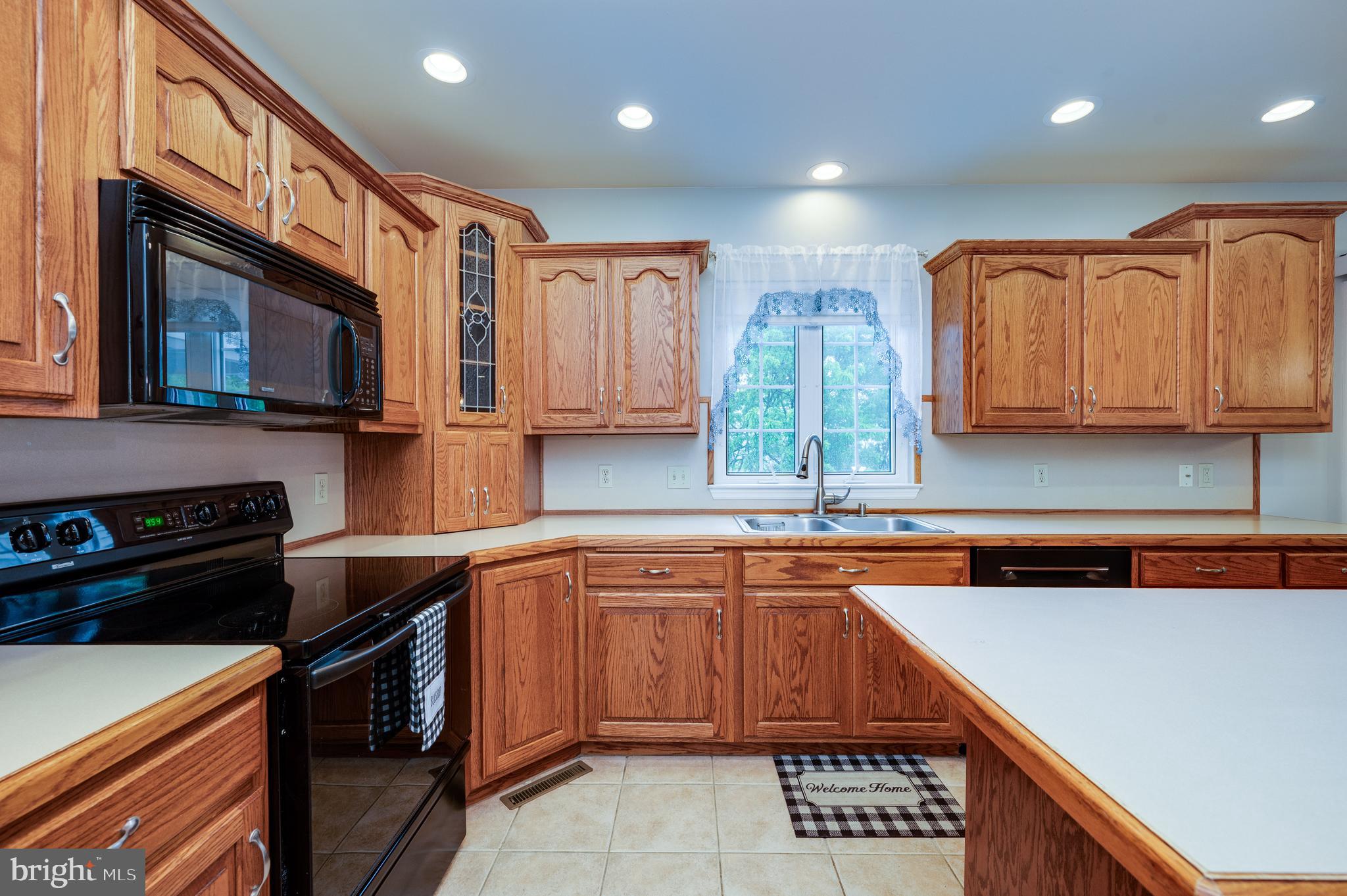 1013 Conifer Road Leesport, PA 19533 - Photo 27 of 102 a kitchen with stainless steel appliances granite countertop a stove a sink and a microwave