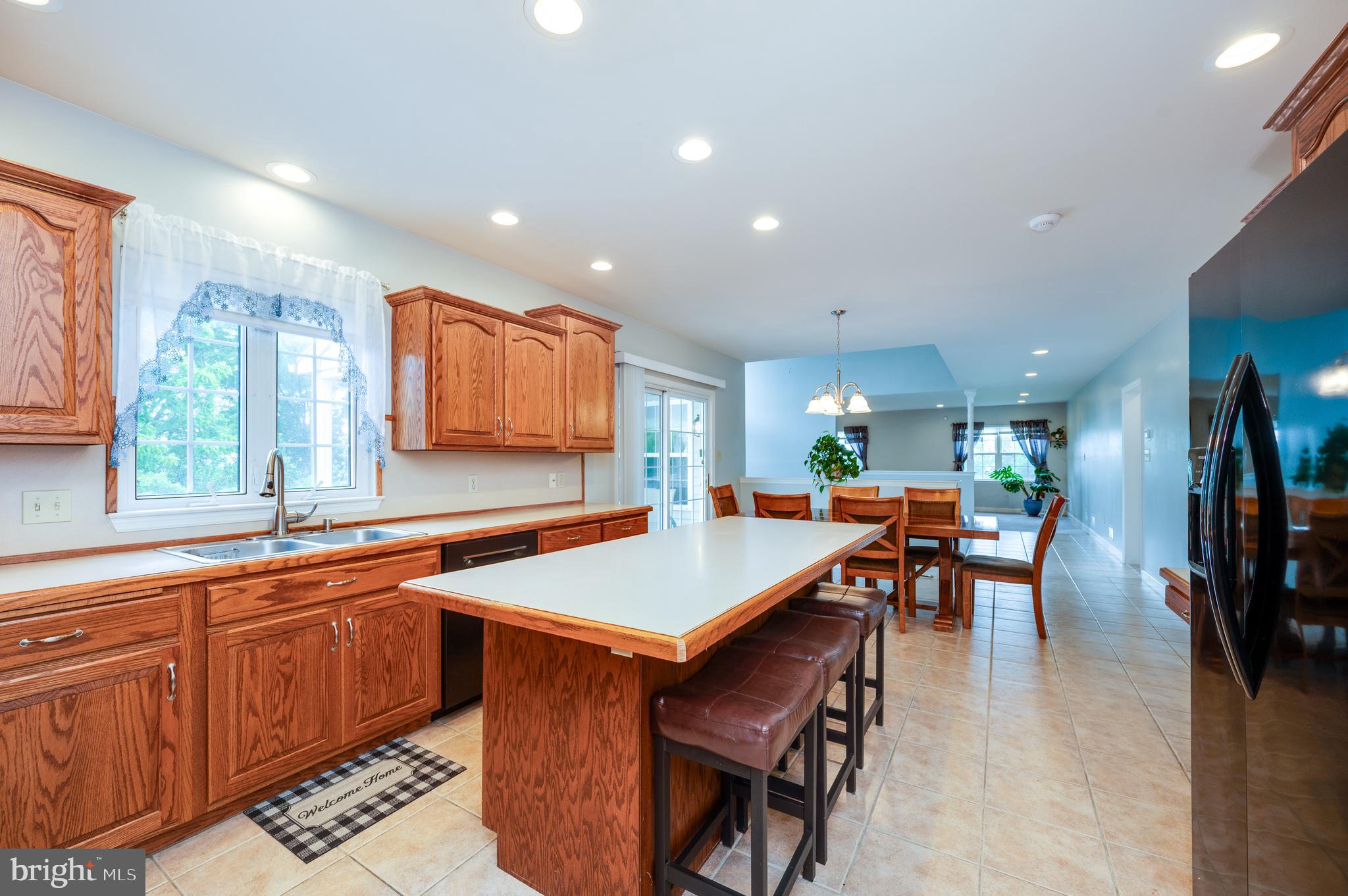 1013 Conifer Road Leesport, PA 19533 - Photo 28 of 102 a kitchen with a table chairs and a refrigerator