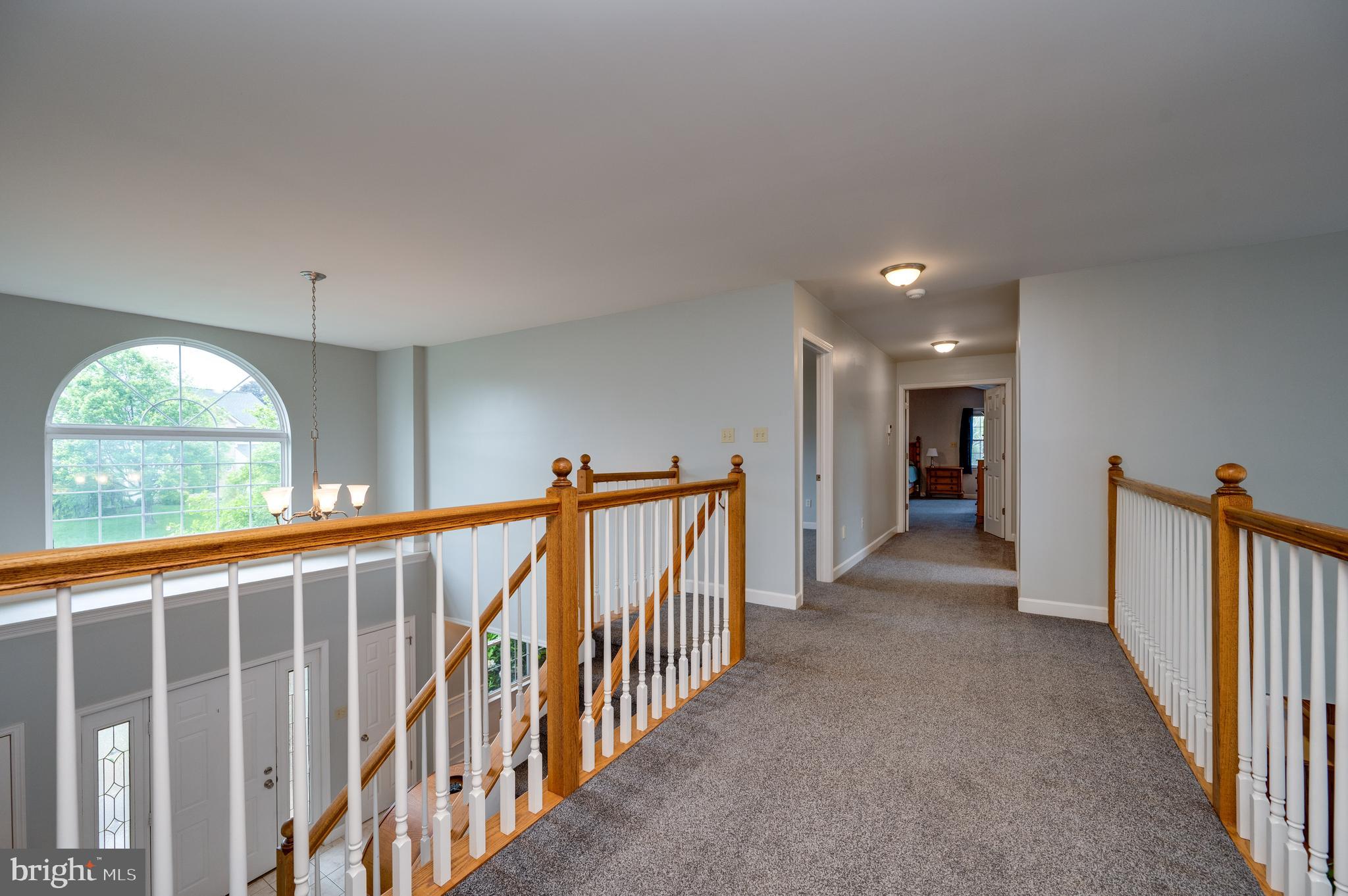 1013 Conifer Road Leesport, PA 19533 - Photo 34 of 102 a view of a hallway with wooden floor and windows