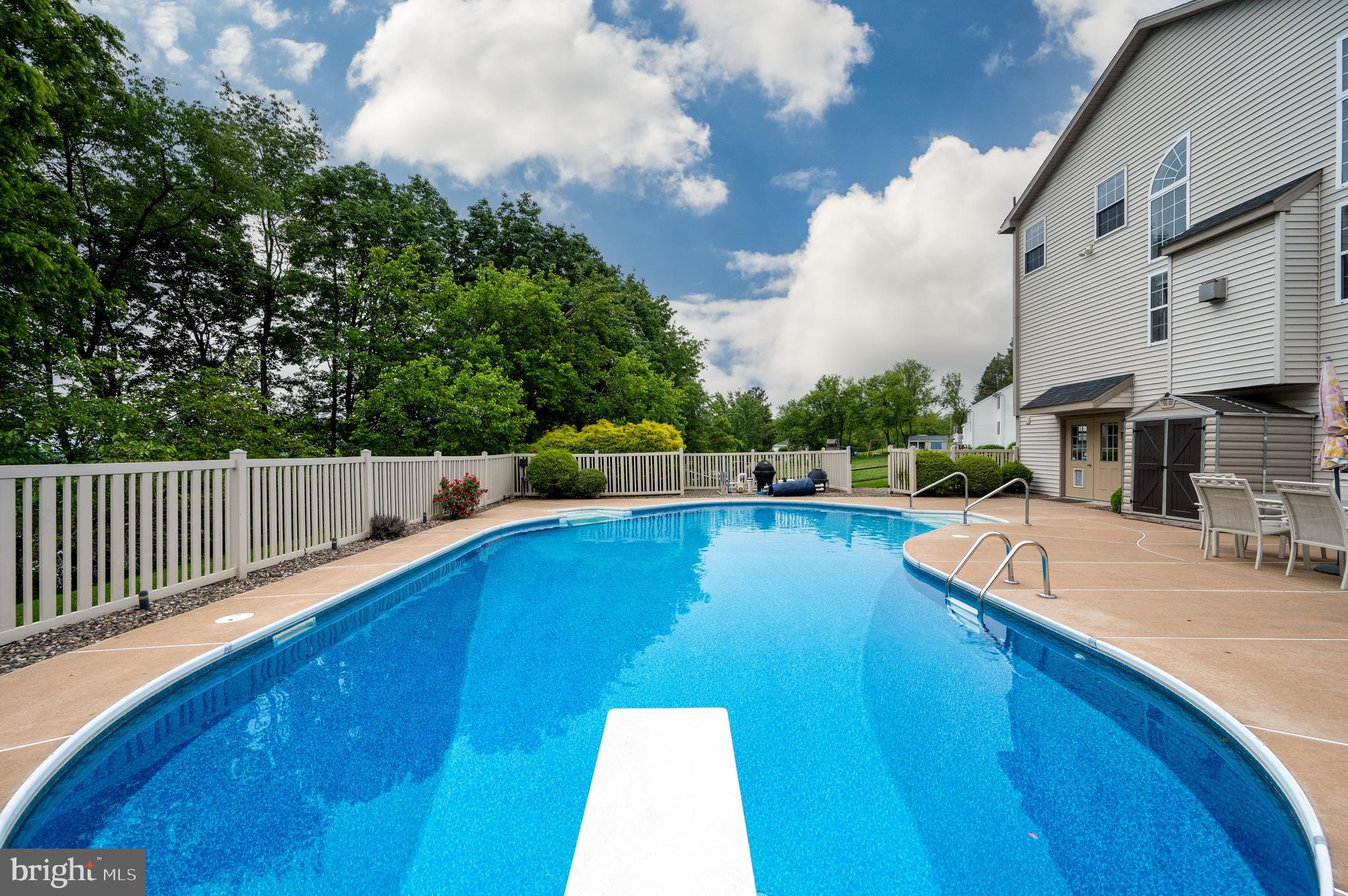 1013 Conifer Road Leesport, PA 19533 - Photo 75 of 102 a view of a swimming pool with a chair and tables