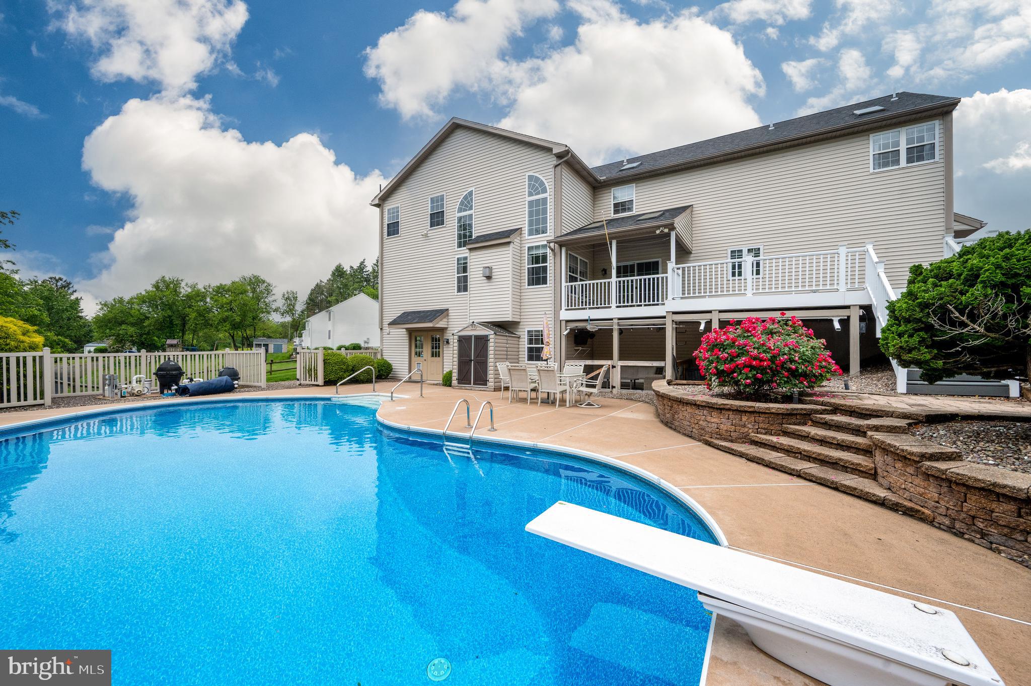 1013 Conifer Road Leesport, PA 19533 - Photo 76 of 102 a view of a swimming pool with lounge chair