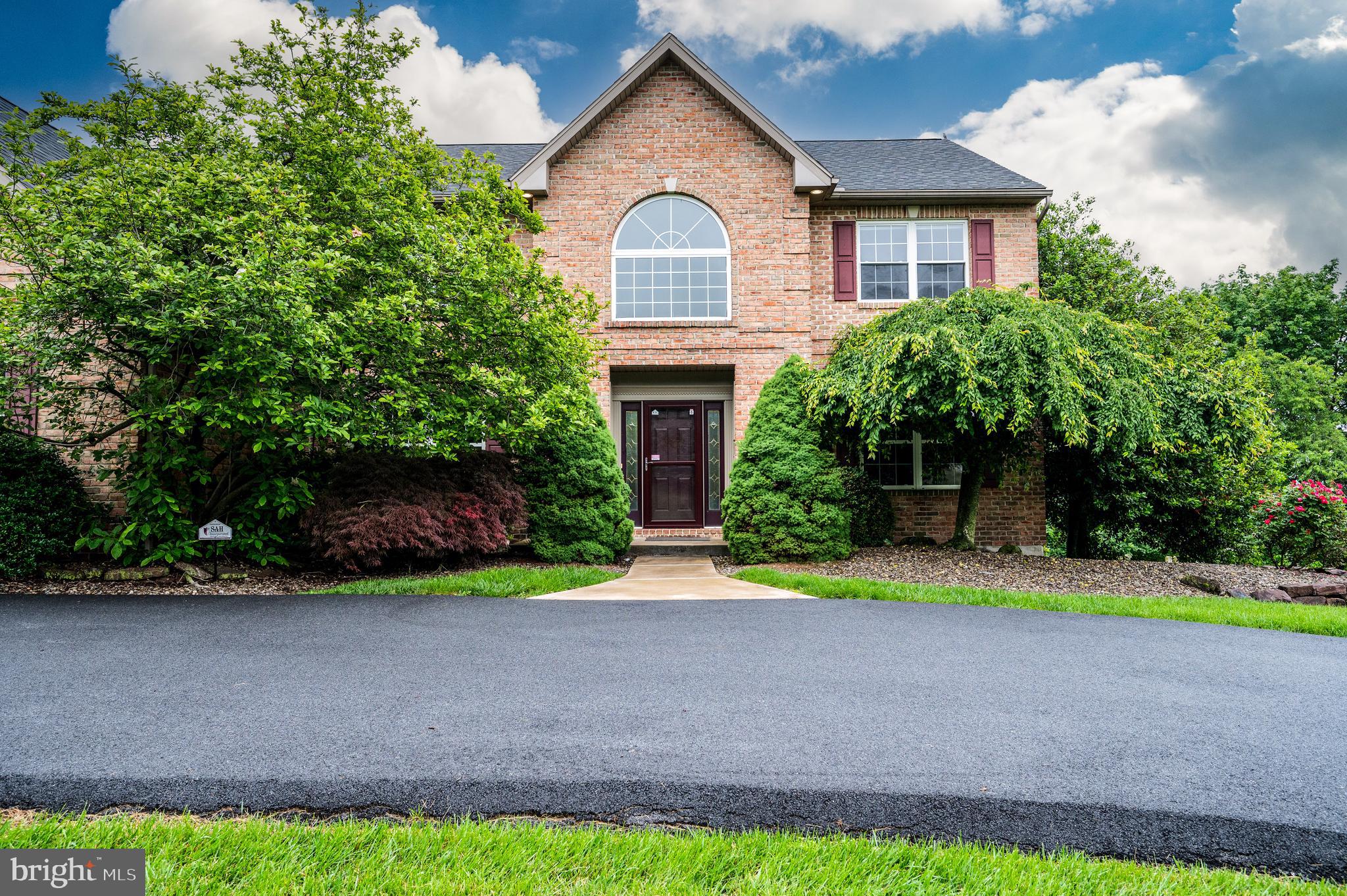 1013 Conifer Road Leesport, PA 19533 - Photo 83 of 102 a front view of a house with a yard and a garage