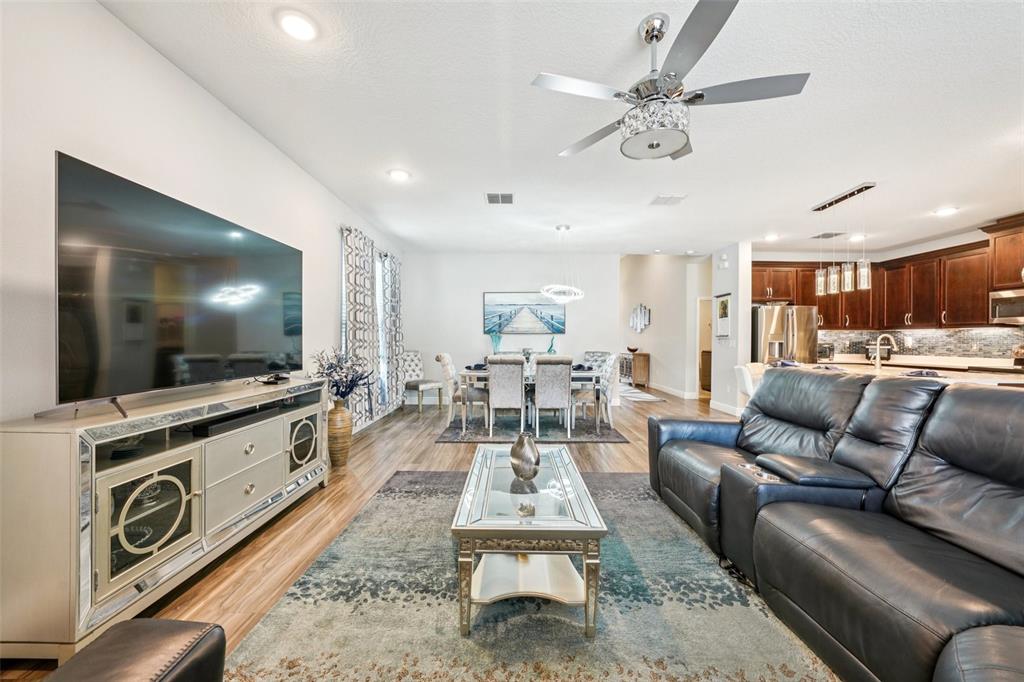 12627 Vander Way New Port Richey, FL 34654 - Photo 12 of 77 a living room with furniture and a flat screen tv