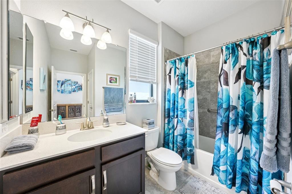 12627 Vander Way New Port Richey, FL 34654 - Photo 36 of 77 a bathroom with a sink vanity mirror and toilet
