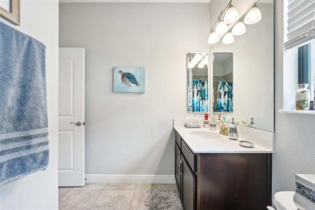 12627 Vander Way New Port Richey, FL 34654 - Photo 37 of 77 a bathroom with a sink vanity and a mirror