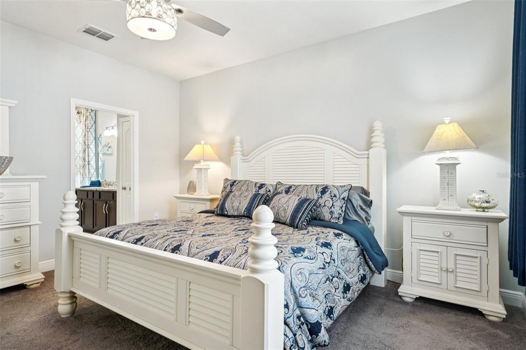 12627 Vander Way New Port Richey, FL 34654 - Photo 45 of 77 a bedroom with a bed and a dresser