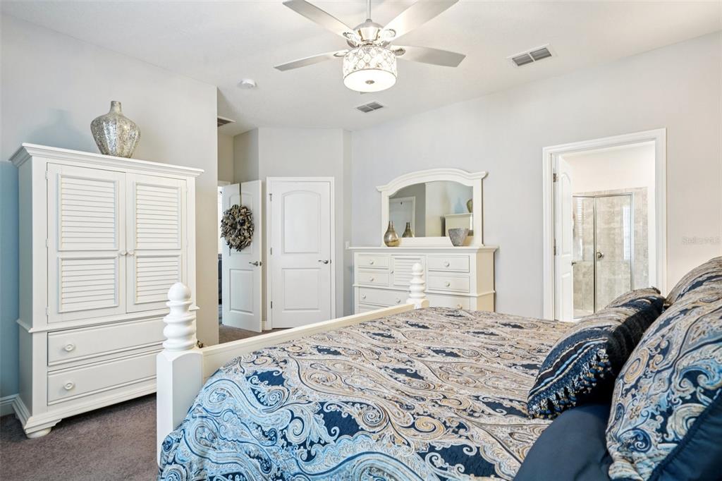 12627 Vander Way New Port Richey, FL 34654 - Photo 46 of 77 a bedroom with a bed and a dresser