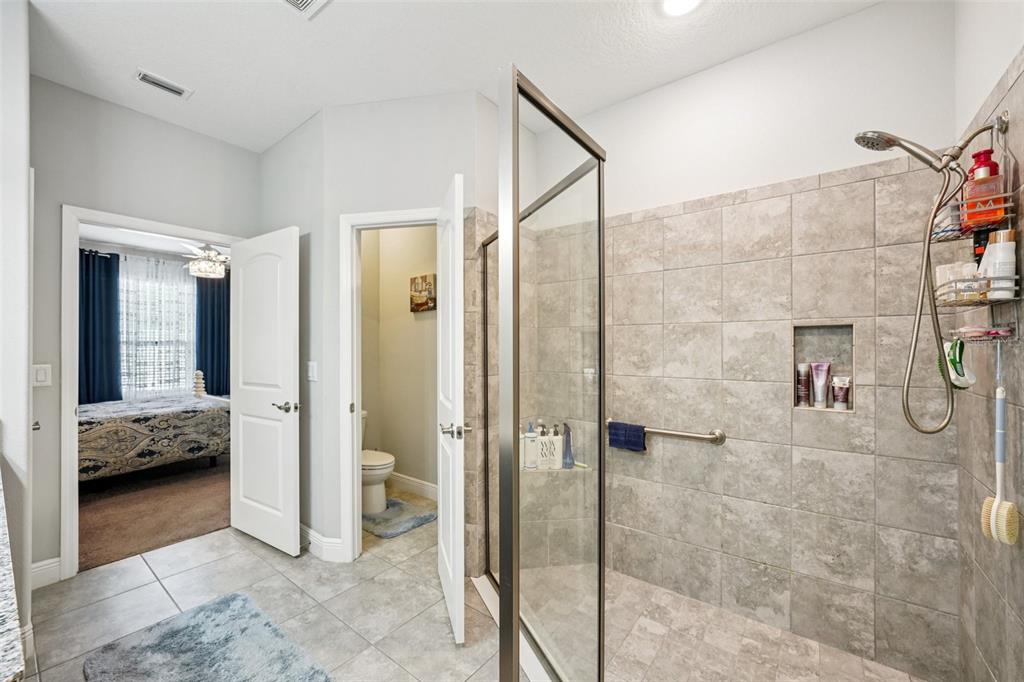 12627 Vander Way New Port Richey, FL 34654 - Photo 51 of 77 a bathroom with a shower and a sink