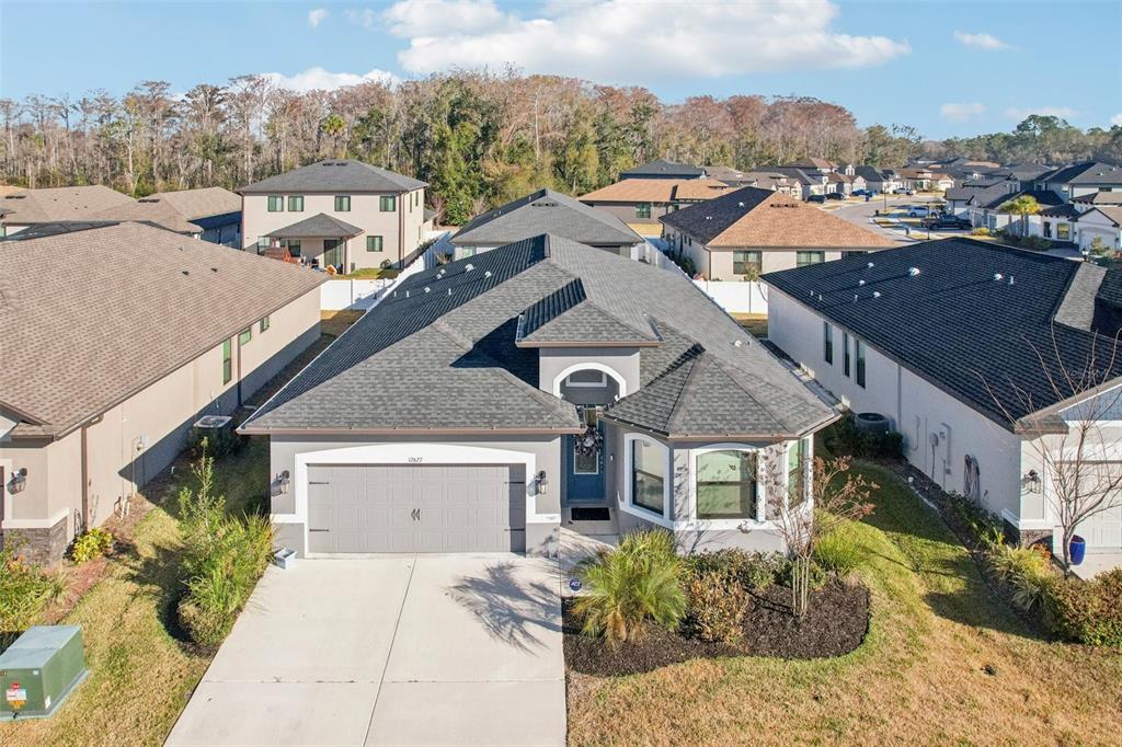 12627 Vander Way New Port Richey, FL 34654 - Photo 61 of 77 a aerial view of a house with a yard and balcony