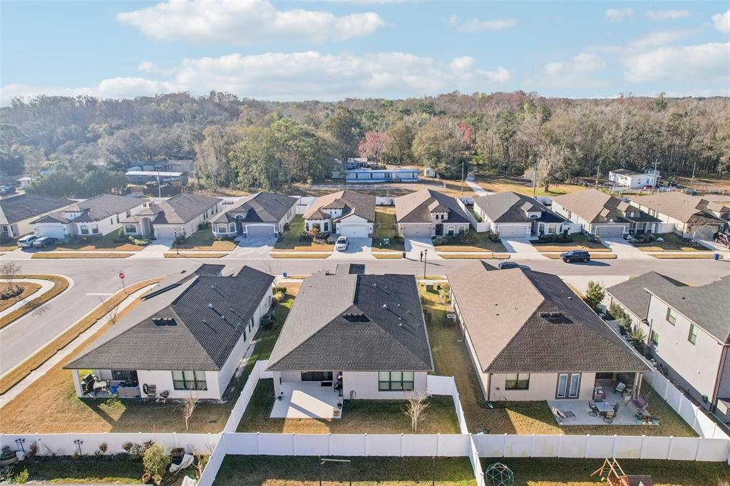 12627 Vander Way New Port Richey, FL 34654 - Photo 76 of 77 an aerial view of residential houses with outdoor space and river