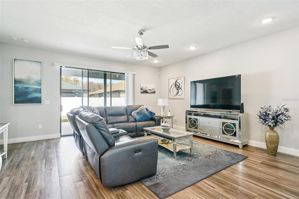 12627 Vander Way New Port Richey, FL 34654 - Photo 8 of 77 a living room with furniture and a flat screen tv