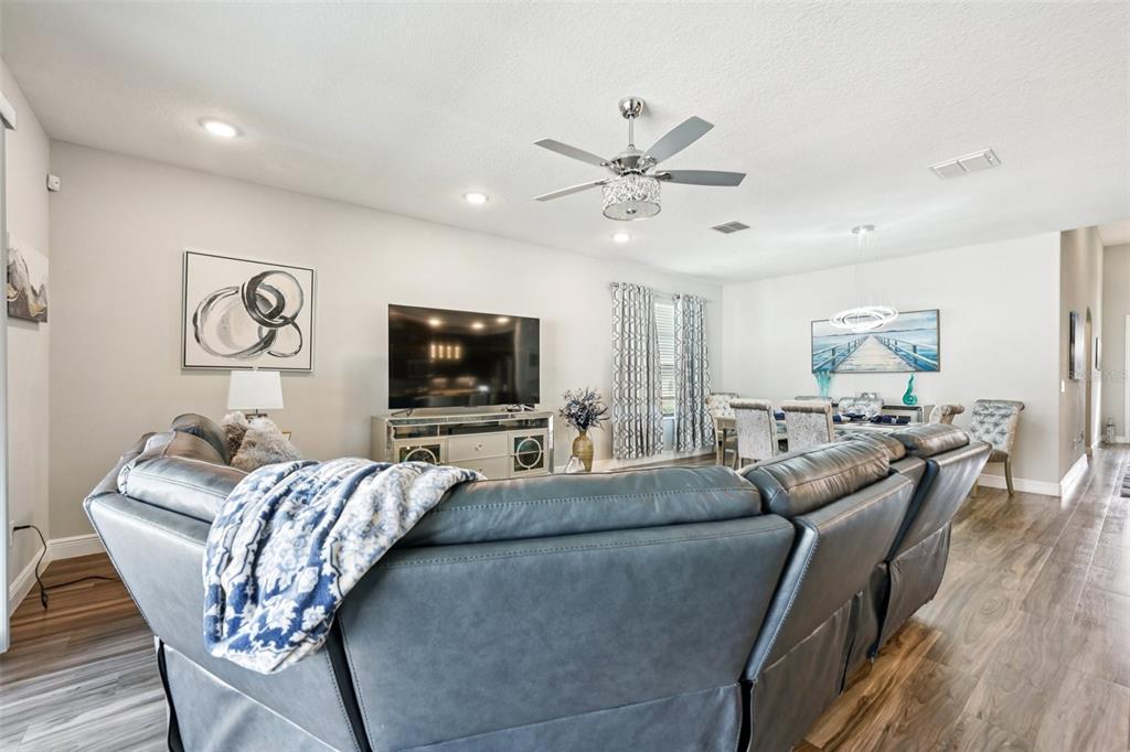 12627 Vander Way New Port Richey, FL 34654 - Photo 10 of 77 a living room with furniture and a flat screen tv