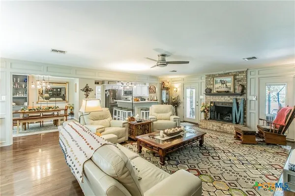 a living room with furniture or couch and a wooden floor