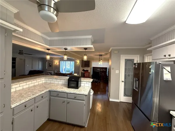a view of workspace with wooden floor and closet