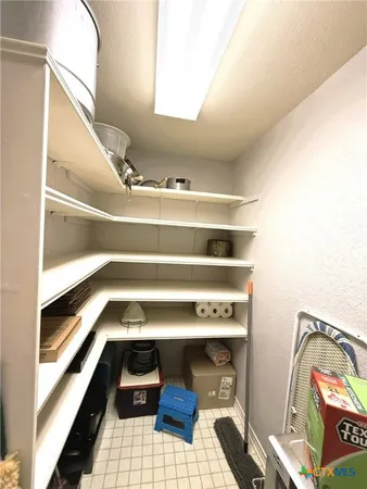 a utility room with closet dryer and washer