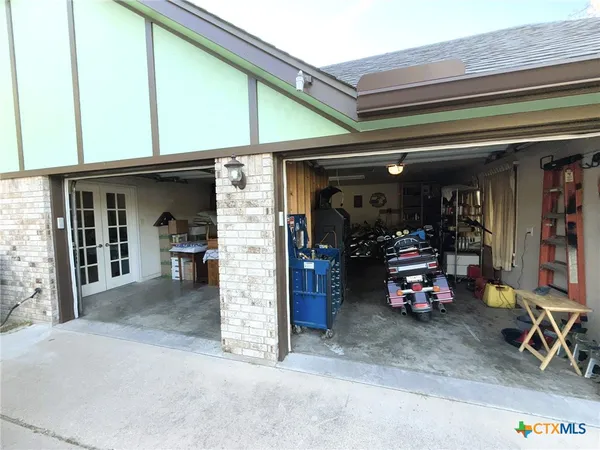 a view of a garage with table and chairs
