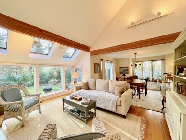 1 Meetinghouse Village Way, Unit 1 ED335 Edgartown, MA 02539 - Photo 3 of 8 a living room with furniture large windows and wooden floor