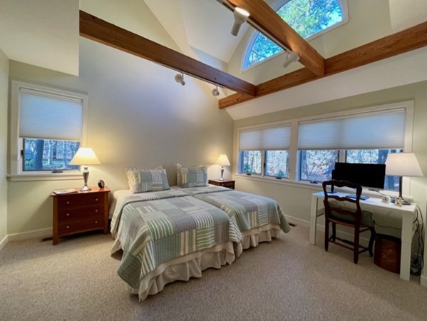1 Meetinghouse Village Way, Unit 1 ED335 Edgartown, MA 02539 - Photo 5 of 8 a spacious bedroom with a bed and a table in it