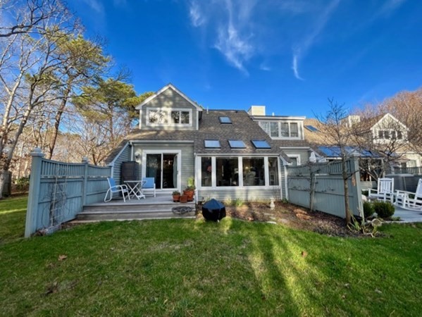 1 Meetinghouse Village Way, Unit 1 ED335 Edgartown, MA 02539 - Photo 7 of 8 a view of a house with furniture and garden