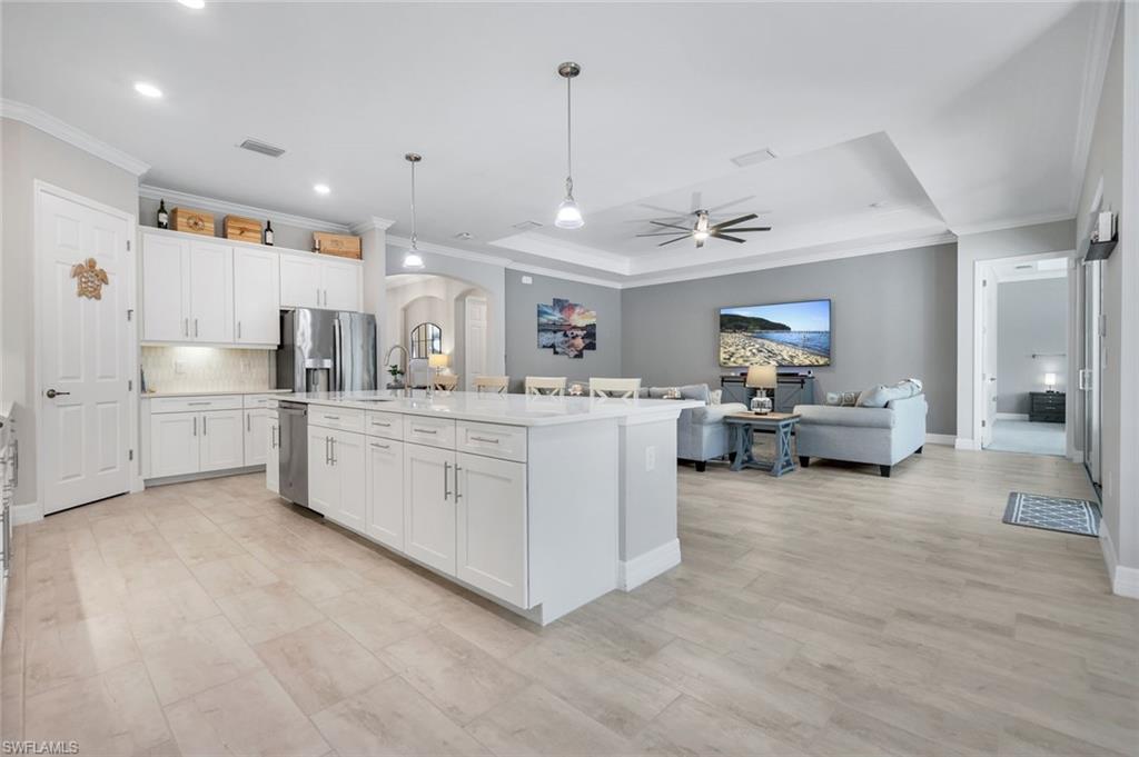 14841 Blue Bay Circle Fort Myers, FL 33913 - Photo 13 of 47 a living room with furniture and a chandelier