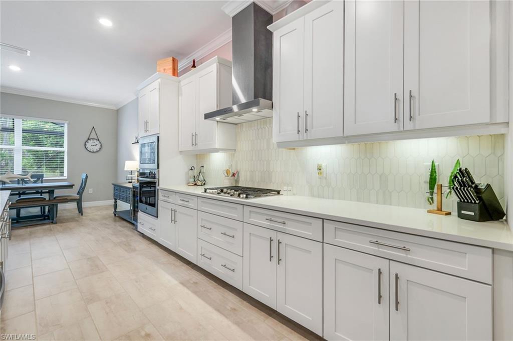 14841 Blue Bay Circle Fort Myers, FL 33913 - Photo 15 of 47 a kitchen with white cabinets and sink