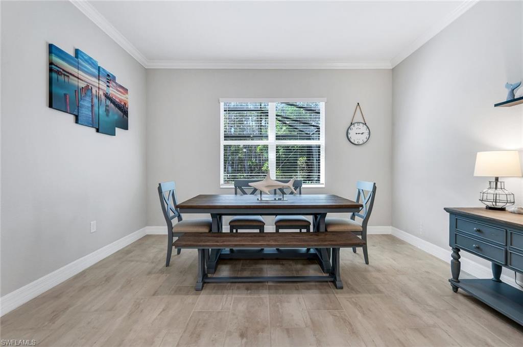 14841 Blue Bay Circle Fort Myers, FL 33913 - Photo 17 of 47 a view of a dining room with furniture window and wooden floor