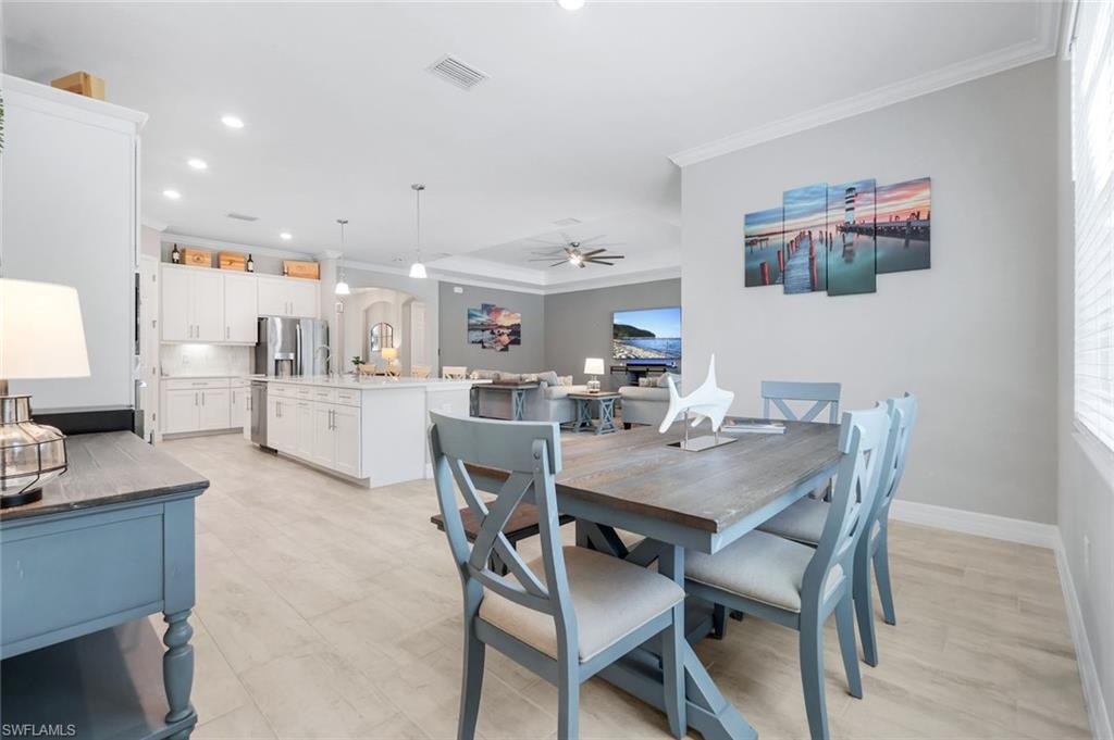 14841 Blue Bay Circle Fort Myers, FL 33913 - Photo 18 of 47 a view of a dining room with furniture and a potted plant