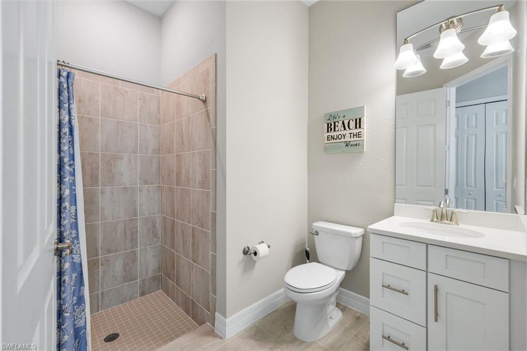 14841 Blue Bay Circle Fort Myers, FL 33913 - Photo 24 of 47 a bathroom with a sink a toilet and shower