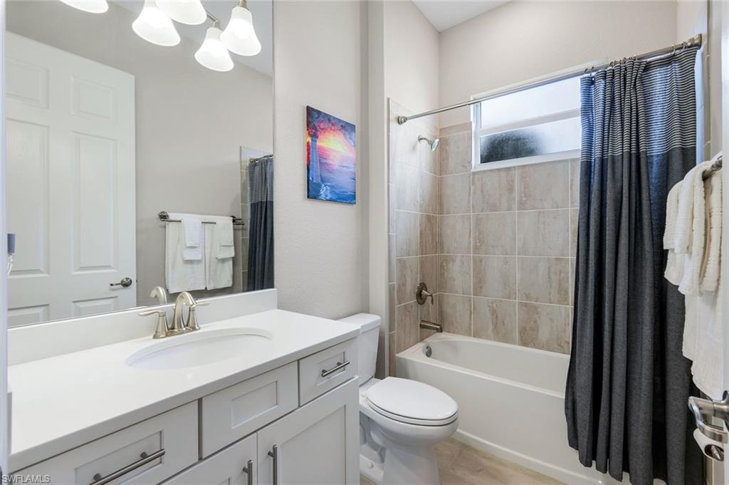 14841 Blue Bay Circle Fort Myers, FL 33913 - Photo 27 of 47 a bathroom with a sink a toilet and shower