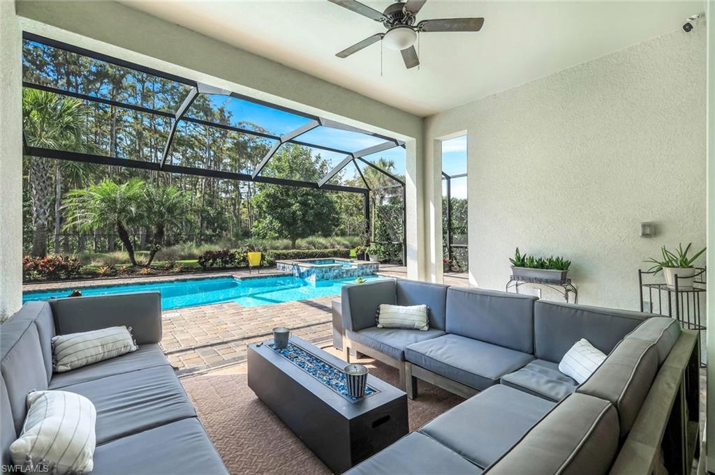14841 Blue Bay Circle Fort Myers, FL 33913 - Photo 30 of 47 a living room with furniture and a large window
