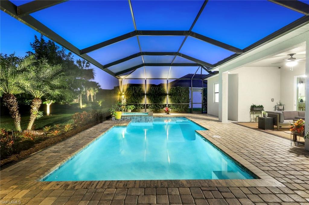 14841 Blue Bay Circle Fort Myers, FL 33913 - Photo 36 of 47 a view of a backyard swimming pool with a patio