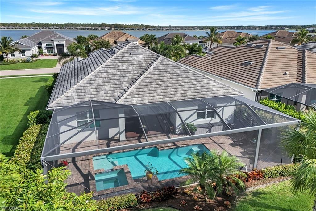 14841 Blue Bay Circle Fort Myers, FL 33913 - Photo 38 of 47 an aerial view of a house with a garden and lake view