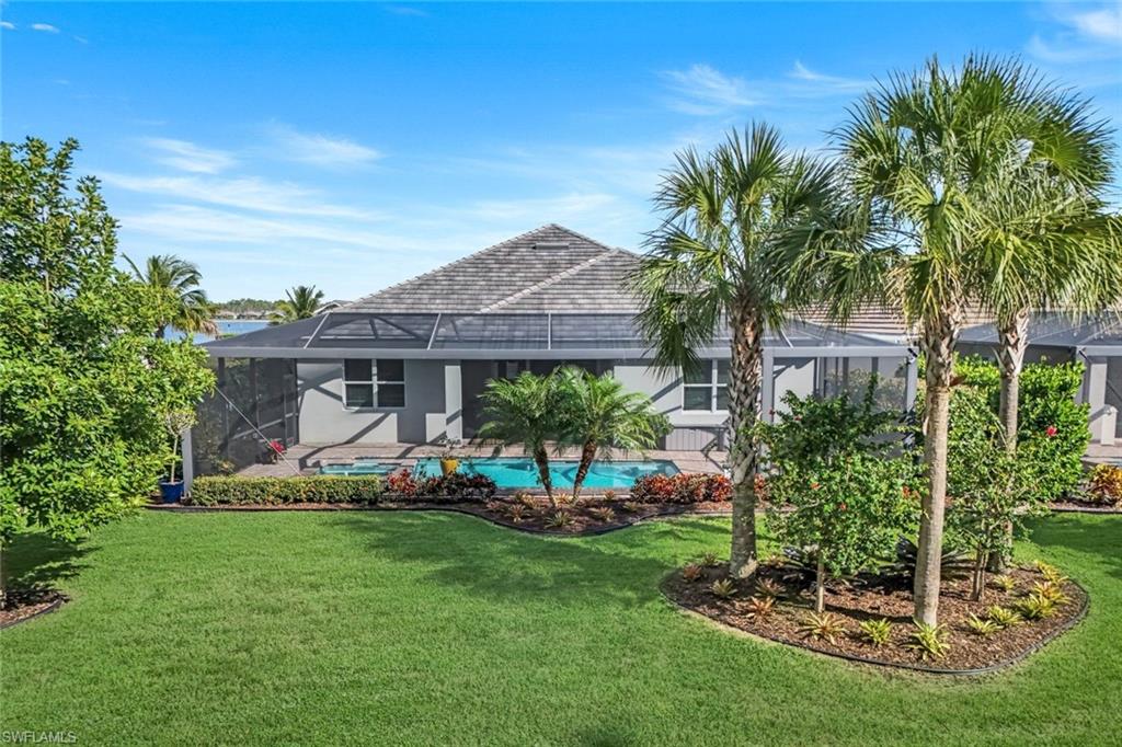 14841 Blue Bay Circle Fort Myers, FL 33913 - Photo 39 of 47 a view of a house with a yard and potted plants