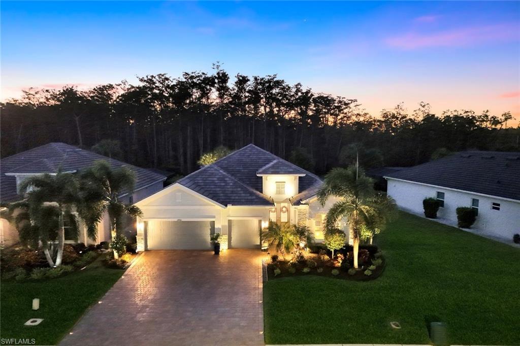 14841 Blue Bay Circle Fort Myers, FL 33913 - Photo 40 of 47 a view of a town with brick wall and large trees