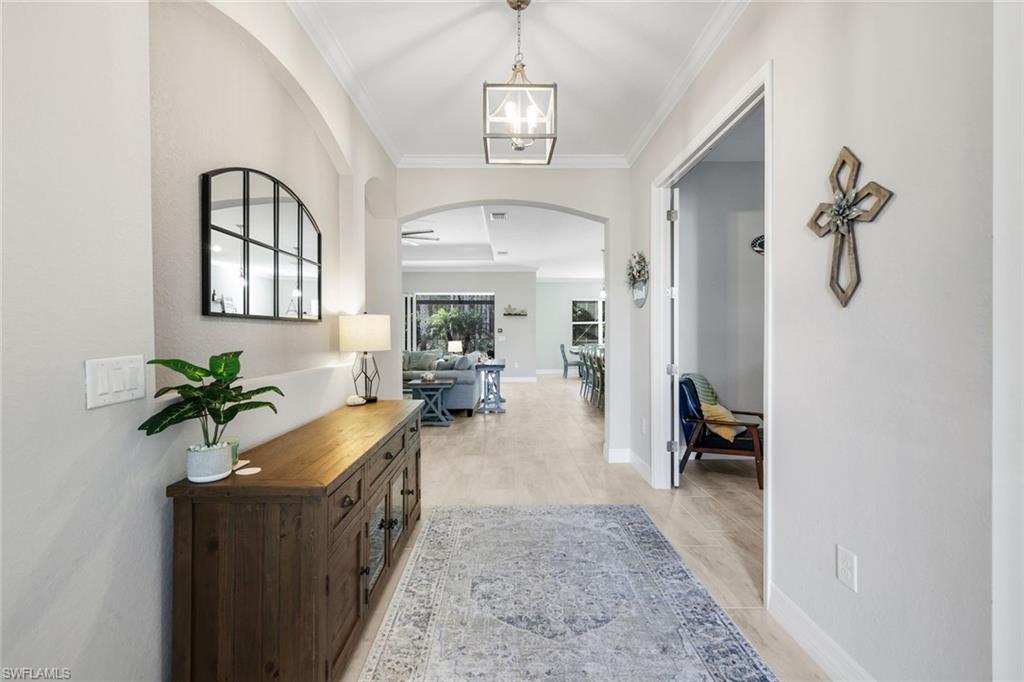 14841 Blue Bay Circle Fort Myers, FL 33913 - Photo 6 of 47 a living room with furniture and a potted plant