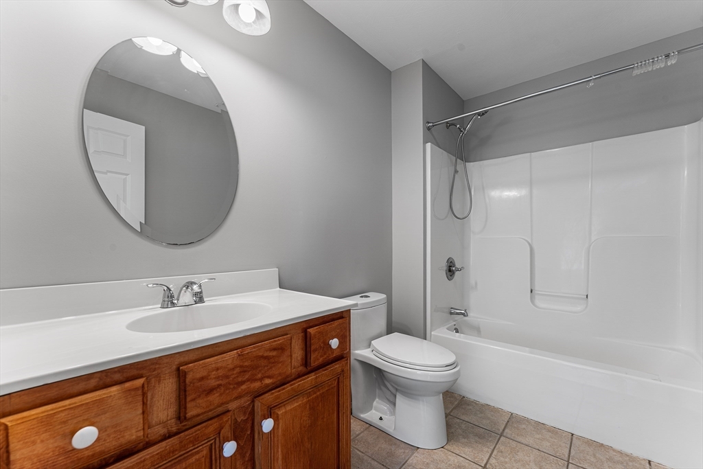 60 Dodge Street, Unit 3 Beverly, MA 01915 - Photo 15 of 30 a bathroom with a sink toilet and shower