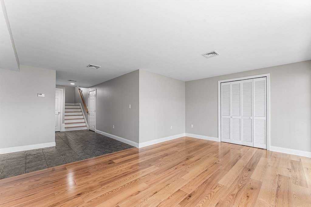 60 Dodge Street, Unit 3 Beverly, MA 01915 - Photo 21 of 30 a view of an empty room with wooden floor