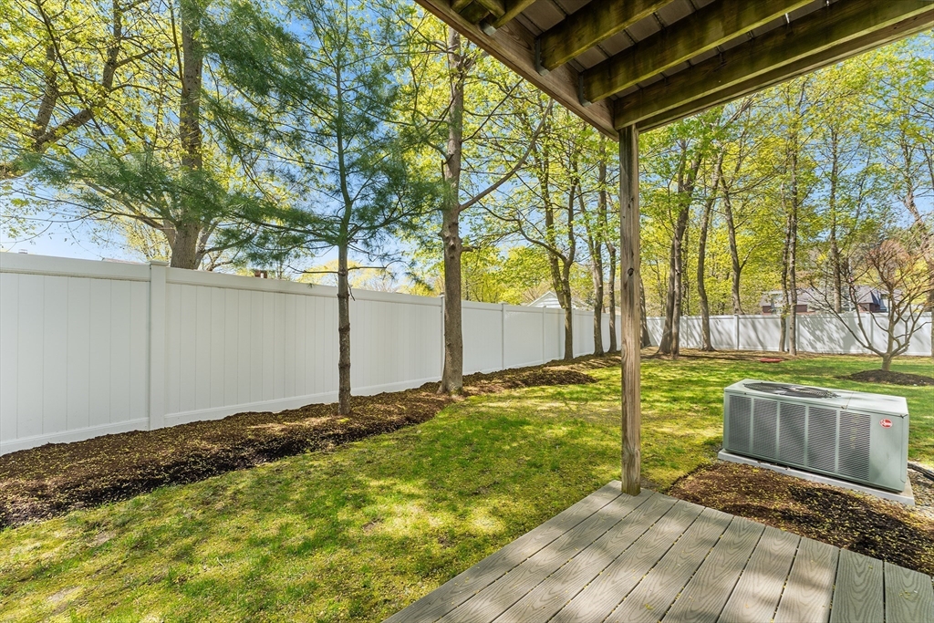 60 Dodge Street, Unit 3 Beverly, MA 01915 - Photo 23 of 30 a view of a backyard with large trees
